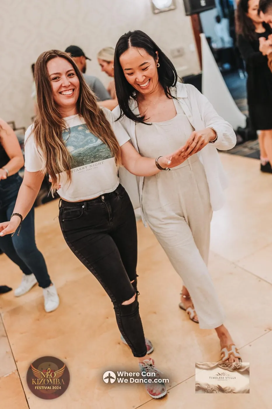 Two dancers laughing as they dance Urban Kiz together